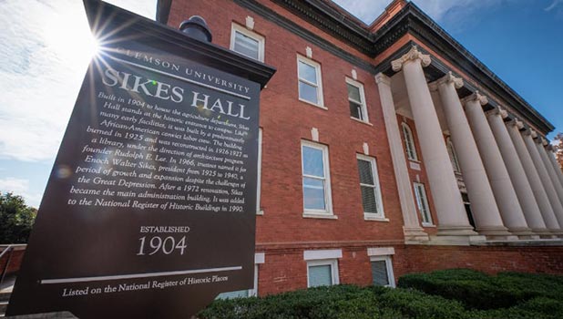 A marker provides historic information about Sikes Hall on Clemson's campus.
