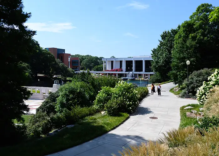 Two people in the distance walk together on the Clemson campus