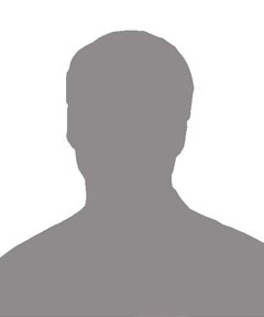 Silhouette of a person’s head and shoulders against a plain background.