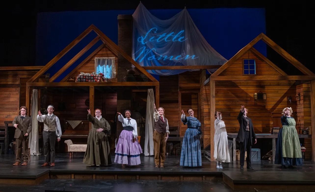  Students performing Little Women at the Brooks Center for Performing Arts motion to the crowd at the end of the show. 