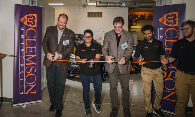 Students and faculty cut a ceremonial ribbon at CU-ICAR in Greenville, South Carolina.