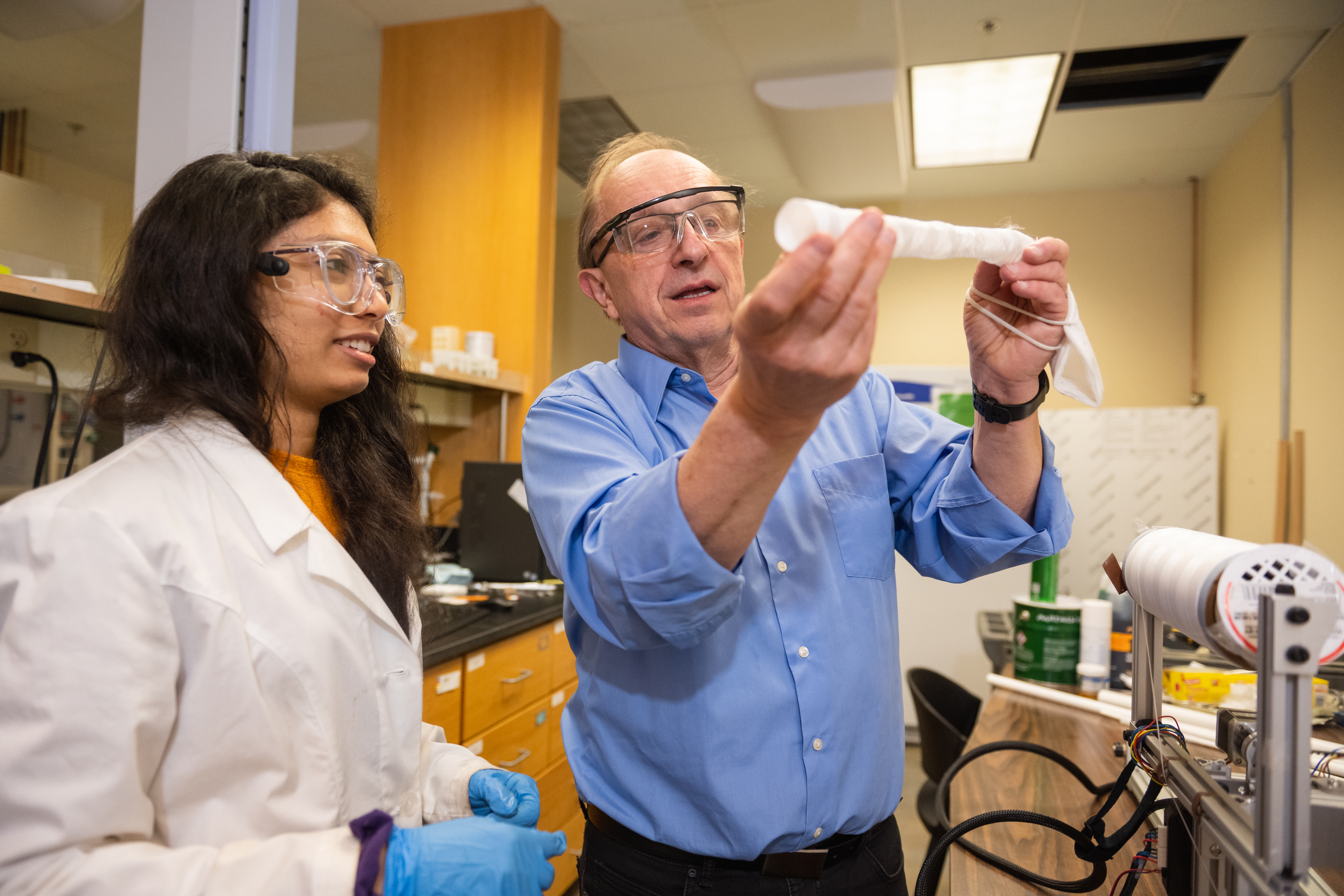 Professor engaging with student in the classroom