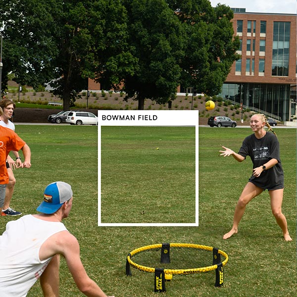  A square is overlaid on an image of students playing spike ball on Bowman with the color title, Bowman Field.