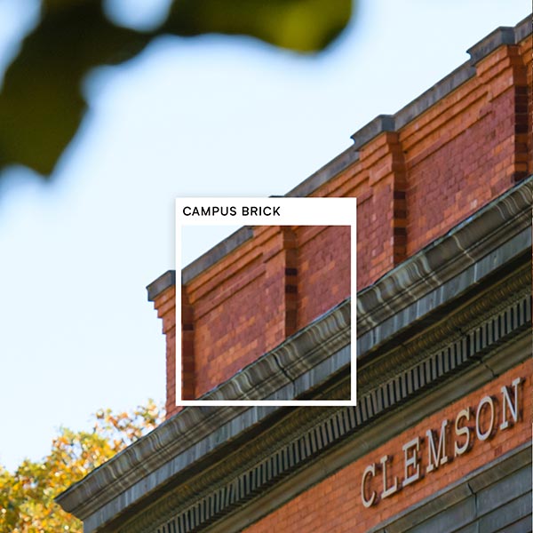 A square is overlaid on the bricks of Sikes Hall with the color title, Campus Brick.