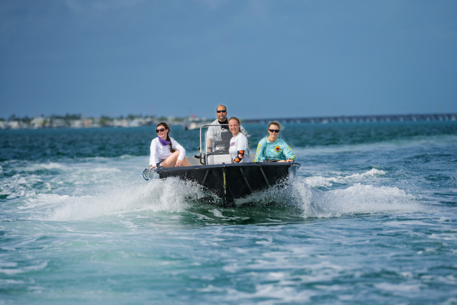  Antonio Baeza drives a speed boat with three students through the Florida Keys to research spiny tailed lobsters