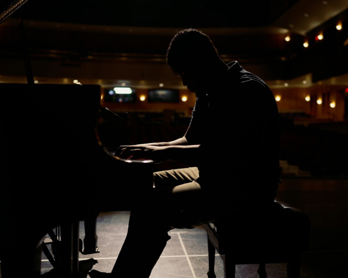 student playing piano on stage