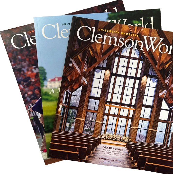 Three issues of Clemson World magazine are fanned out with the Cadden Chapel cover on the top. 