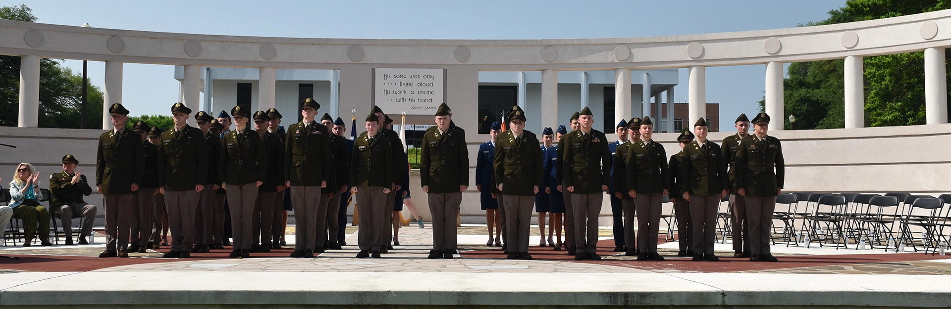 Cadets in dress uniform lined up for photo.