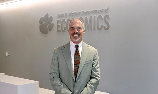 man in suit standing in office space