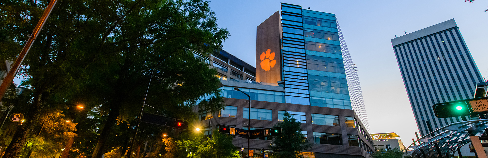 Outside view of Greenville ONE building with Tiger Paw projection.
