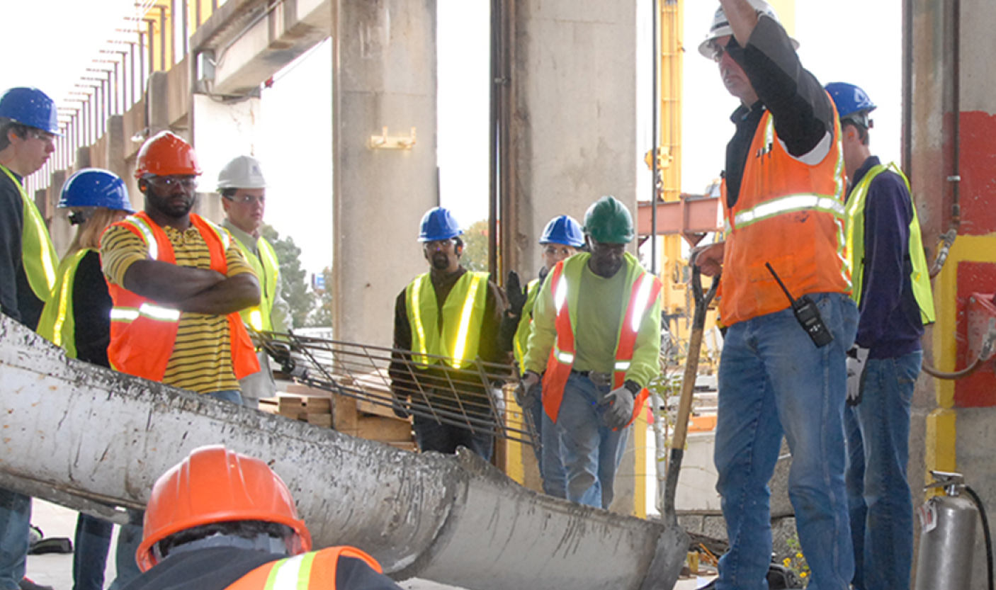 Students on a construction site working with The Pennell Center.