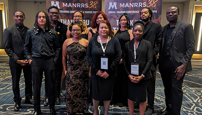 students standing for a picture at the manrrs convention