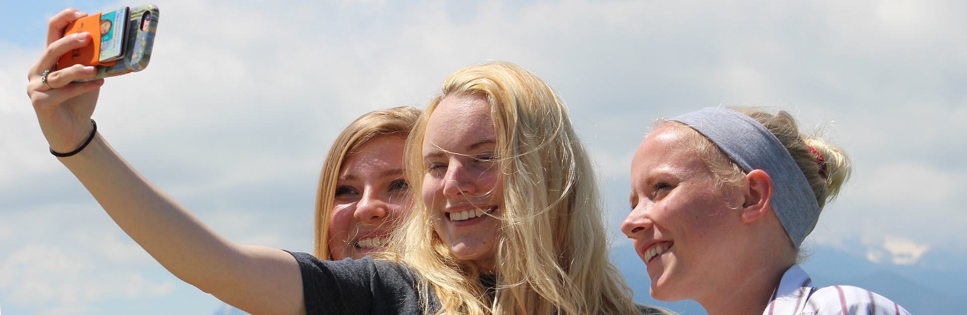 three students taking a selfie