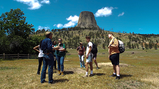 wildlife students standing in a field