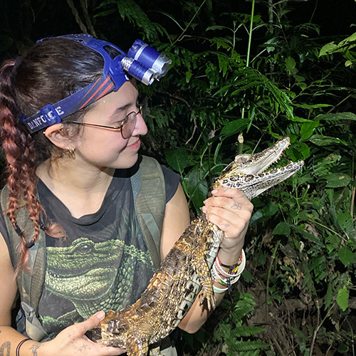 Hallie holding a small alligator