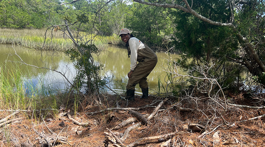 Rene near a lake collecting data