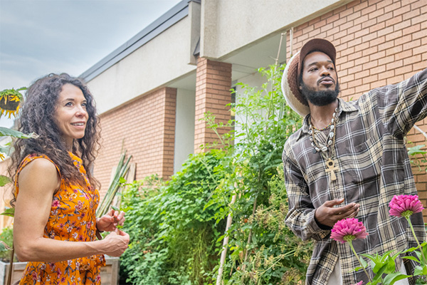 Zay Barton showing off the community garden