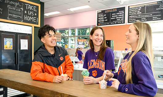 3 students eating ice cream at 55 exchange