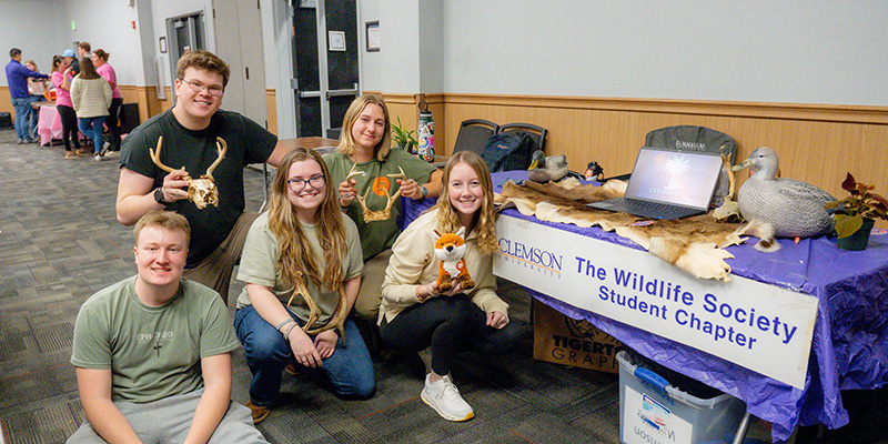 students posing for a picture at an event