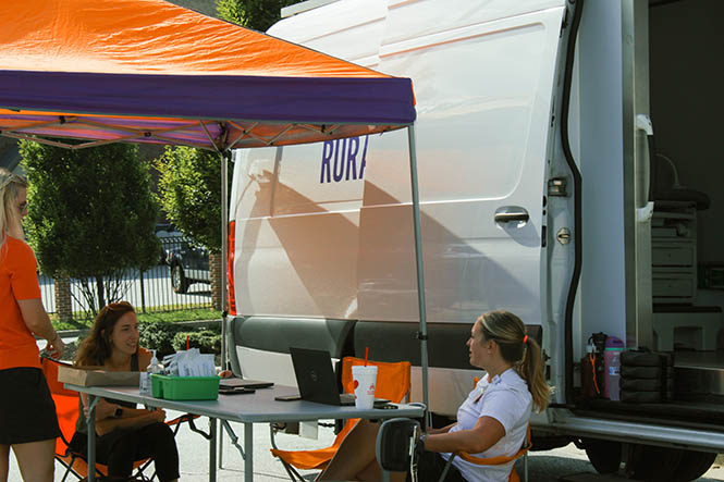 Students outside a Clemson Rural Health Mobile Unit