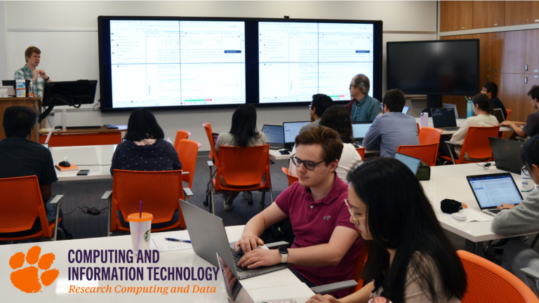 Students work on computers in a classroom in a Research Data and Computing workshop.