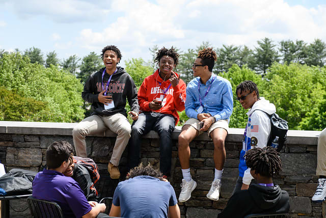 tiger alliance students sitting on ledge