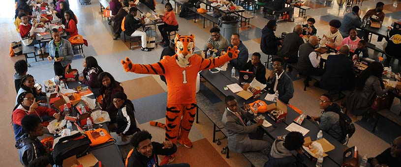 Tiger Mascot poses with students