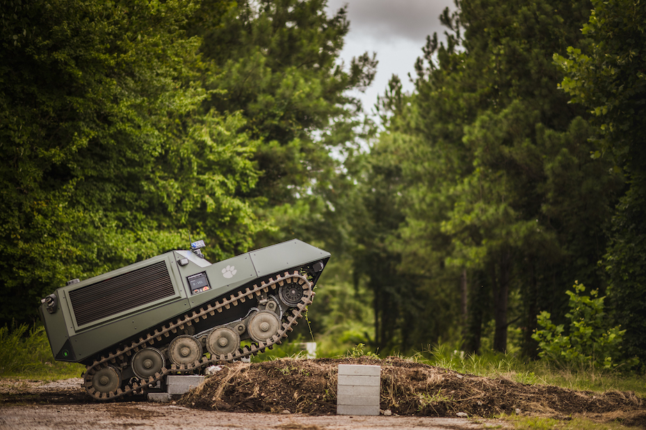 DO14 vehicle scaling an obstacle