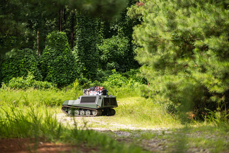 DO14 traverses through a field with medical supplies strapped to its top