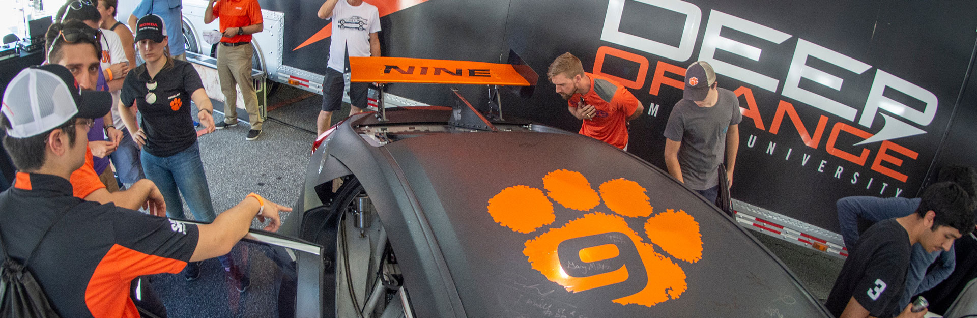 Students looking at the Deep Orange 9 car after it was unveiled