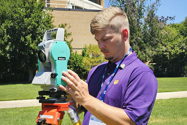 Student surveying at ASCE competition