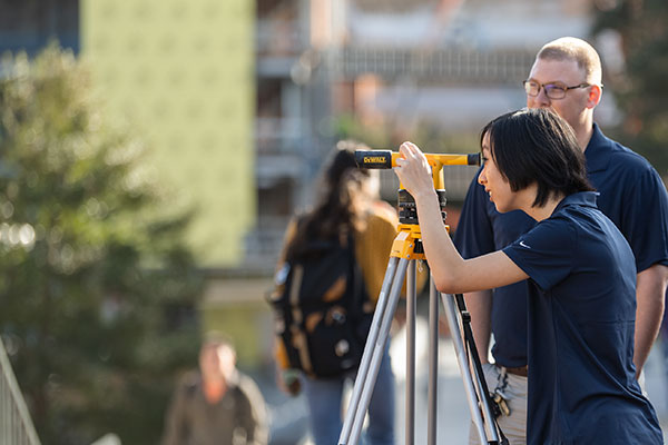 Students using survey tools on campus.