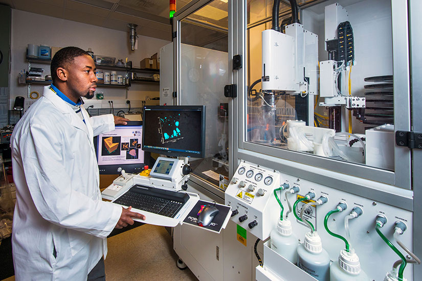 Student in lab using medical equipment