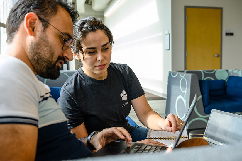 Two students on computer in Charleston