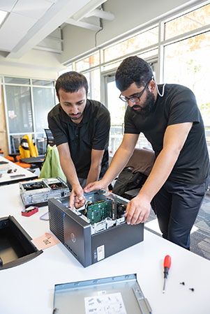 Students looking at inside of server