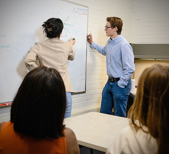 Student and professor at whiteboard