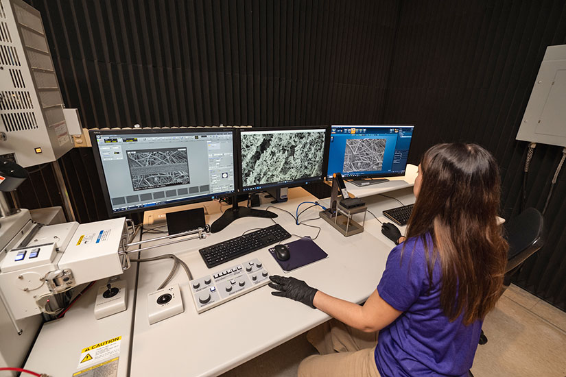 Student viewing results from electron microscopy scan
