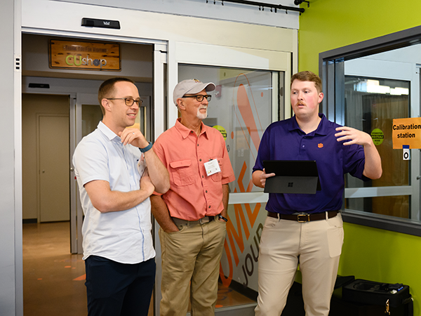 3 men talking at the summit event