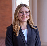 Megan DeGezia in front of the columns at Sikes