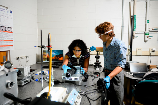 Anjali and Bryson conducting research with camera