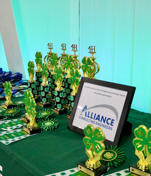 table with a collection of 4h trophies