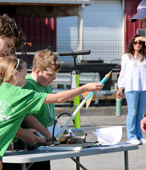 kid launching model rocket