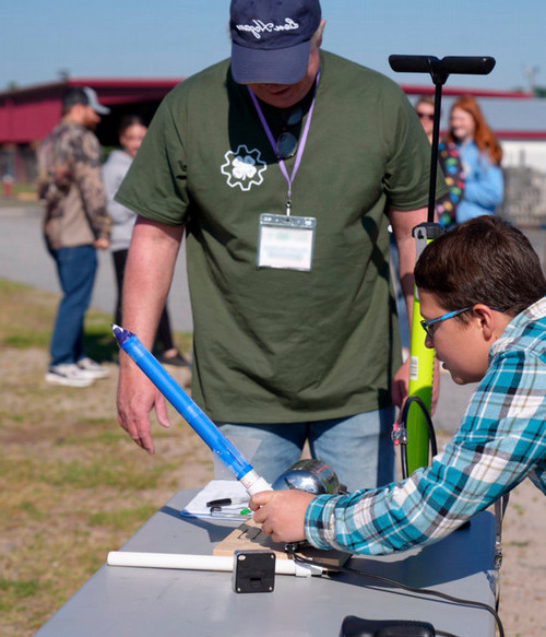 kid launching model rocket