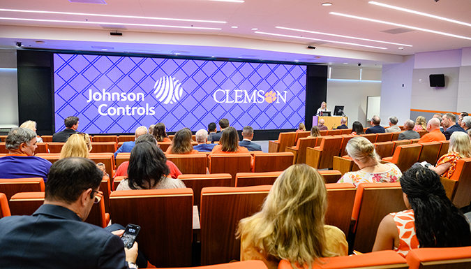 A view of a person speaking in the conference room during the Johnson Controls gift celebration with Clemson University.