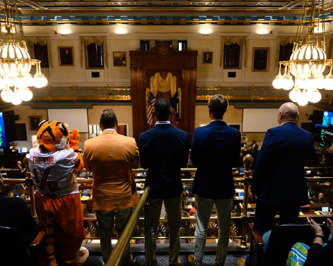 Clemson leadership and the Clemson tiger mascot stand facing the SC state congressional floor.