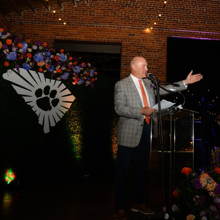 President Clements speaks at a government reception.