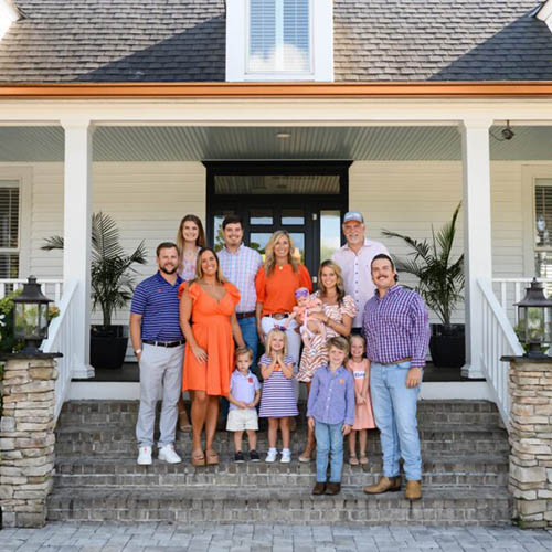 Nieri family poses outside their home