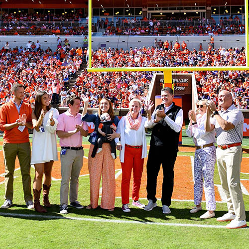 The Snow family gathers to be honored on the football field