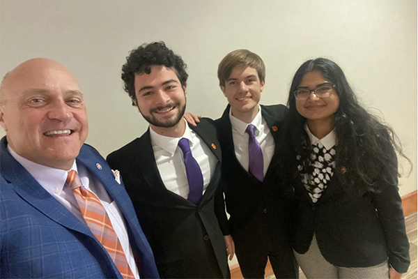 President Clements taking a selfie with three of Clemson's four 2023 Goldwater Scholars.