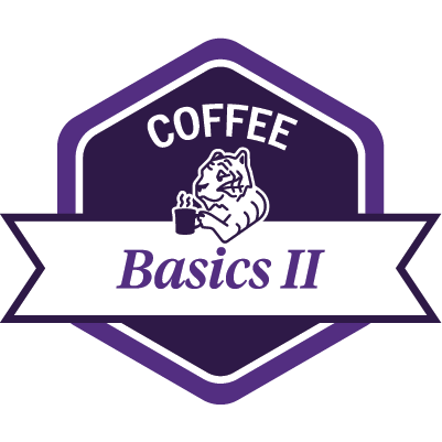 Sample dark purple COFFEE Basics 2 badge featuring a tiger drinking coffee.